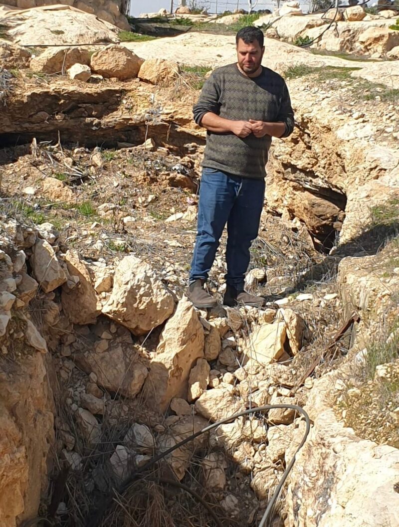 Nasser showing his cave filled in by the Israelis